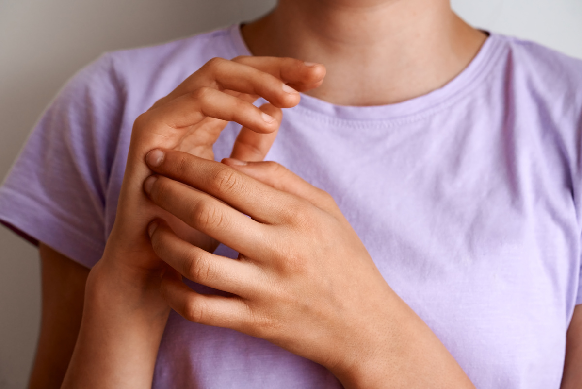 Young girl practicing EFT tapping  or Emotional Freedom Technique